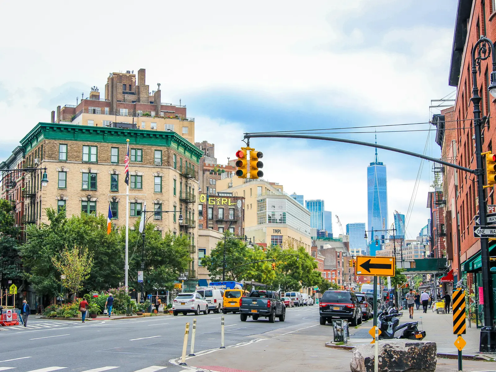 Seventh Avenue running south toward One World Trade Center on a bright day