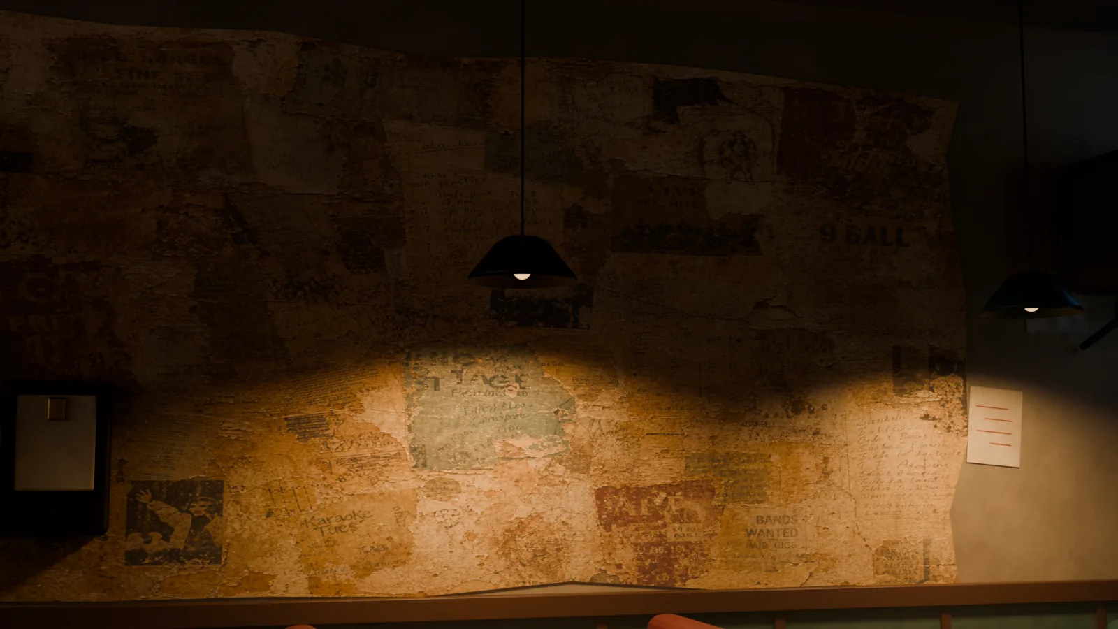 Faded posters and paper remnants wheat-pasted across an old patched bar wall