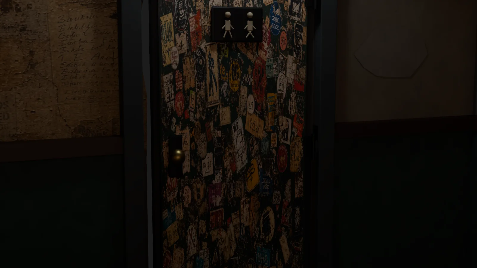 Sticker-covered bathroom door set into patched plaster and dark painted wainscoting