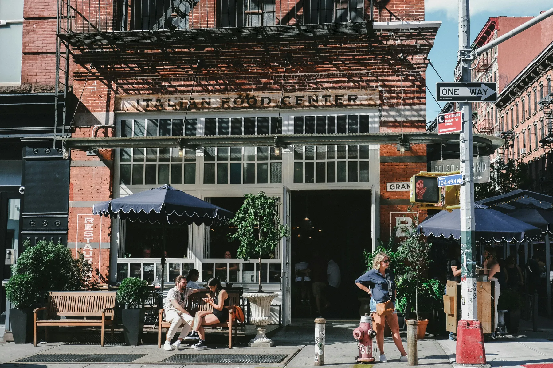 Busy NYC street with small business storefronts