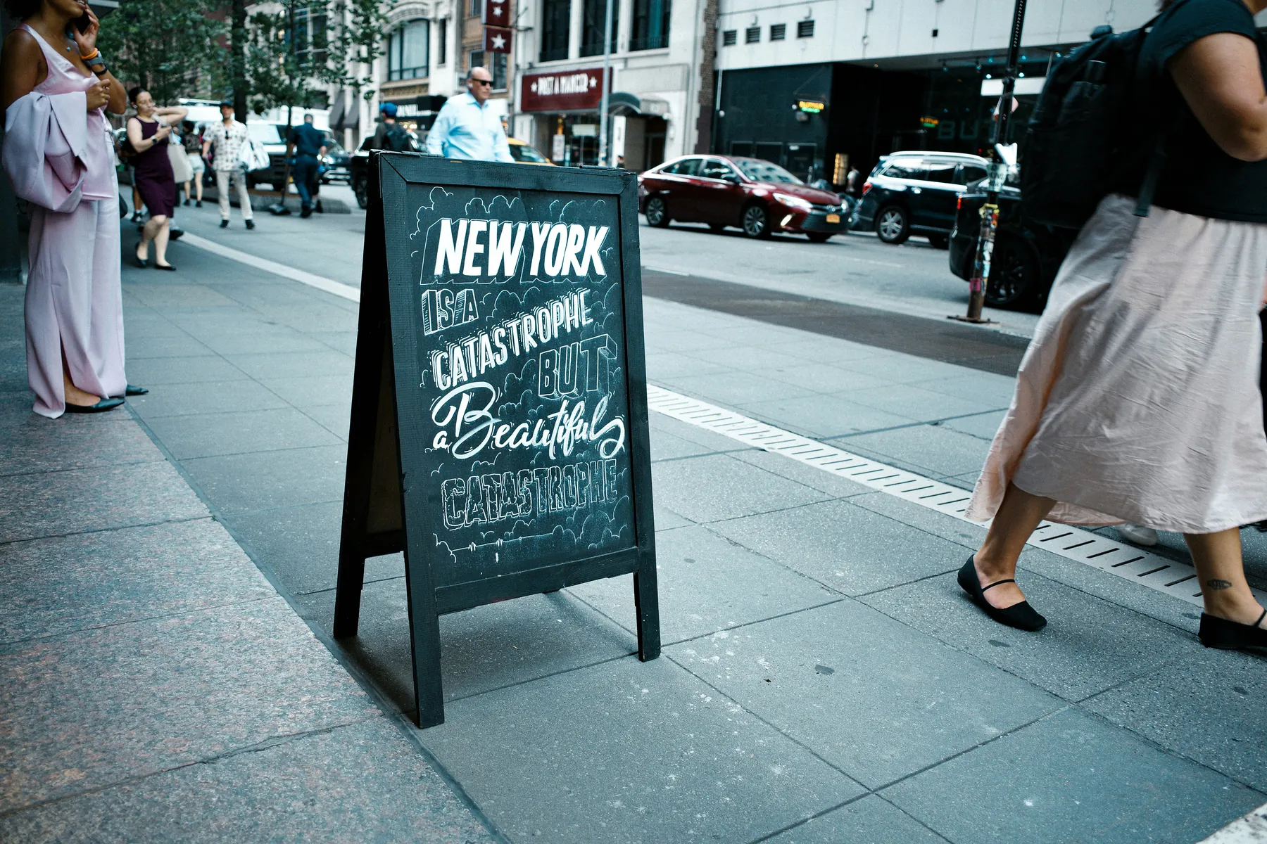 SoHo storefront corridor with modern retail signage.